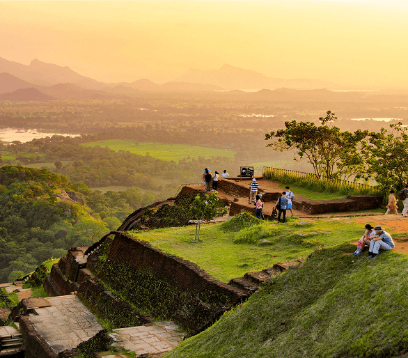 Aerial view from Sigiriya rock at sunset with visitors on the plateau