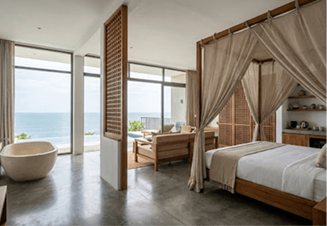 Open-plan luxury suite with ocean-view infinity pool and stone bathtub